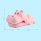 Cartoon hippo bite hand toy in pink with open mouth and visible white teeth