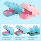 Cartoon hippo bite hand toy pair, blue and pink, open mouths with pink bases