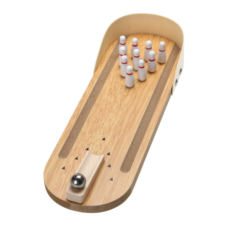 Wooden tabletop mini bowling lane with pins and a metal ball