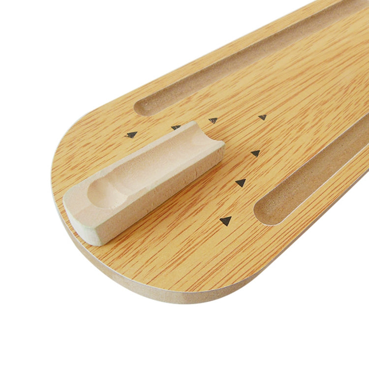 Wooden mini bowling lane close-up with ball return and pin chute
