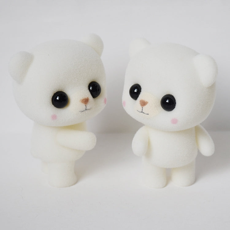 Two white bear doll figurines side by side, glossy black eyes and tiny pink cheeks