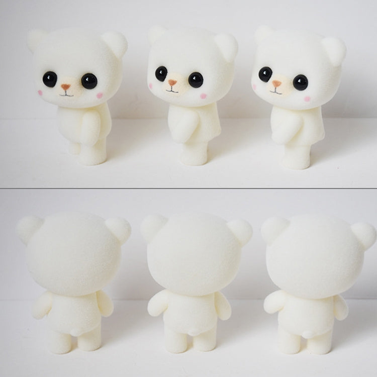 Three white bear doll figurines shown from different angles, with black eyes and pink blush