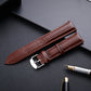 Coffee brown lizard-texture leather watch strap with silver pin buckle, 24mm.