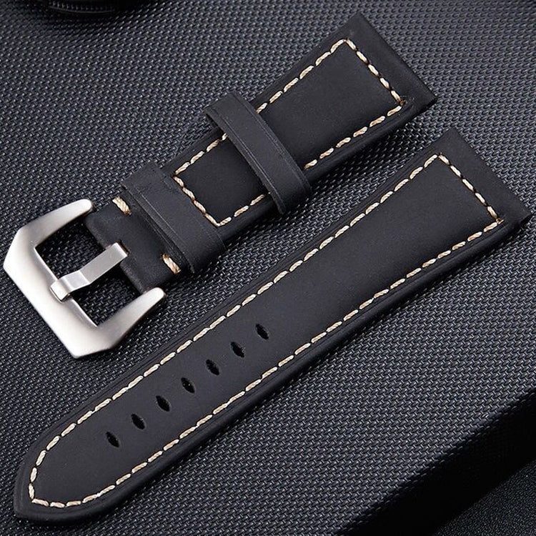 Black leather watch band with silver-tone buckle and cream edge stitching