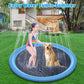 Blue circular sprinkler splash mat outdoors with water spray