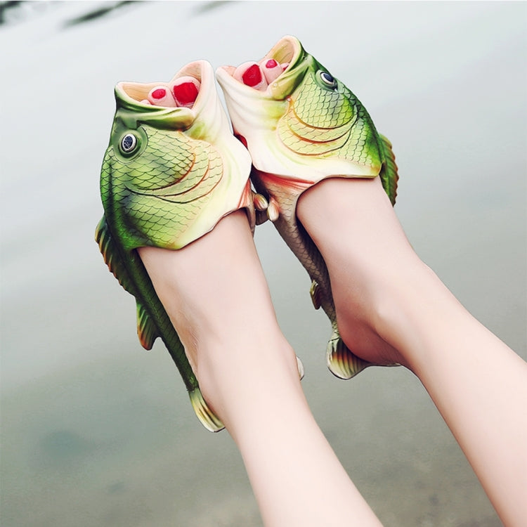 Pair of green fish-shaped EVA kids’ beach sandals on feet, open toe, fin accents
