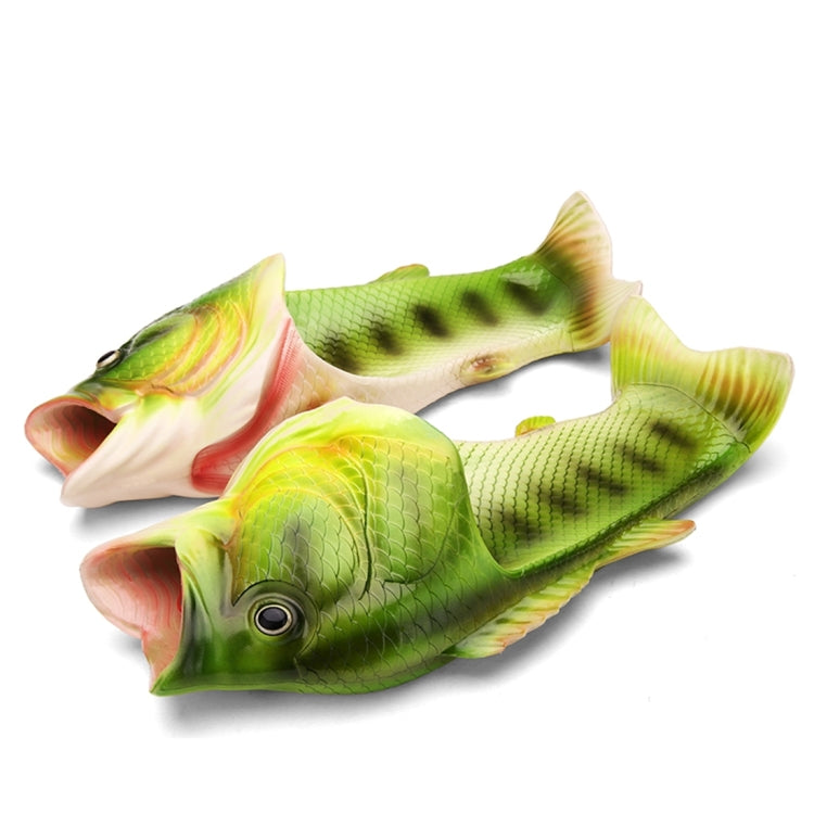 Pair of green fish-shaped slip-on sandals with open toes and molded fins, EVA