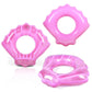 Pink shell-shaped inflatable swimming rings shown in multiple angles with round center opening