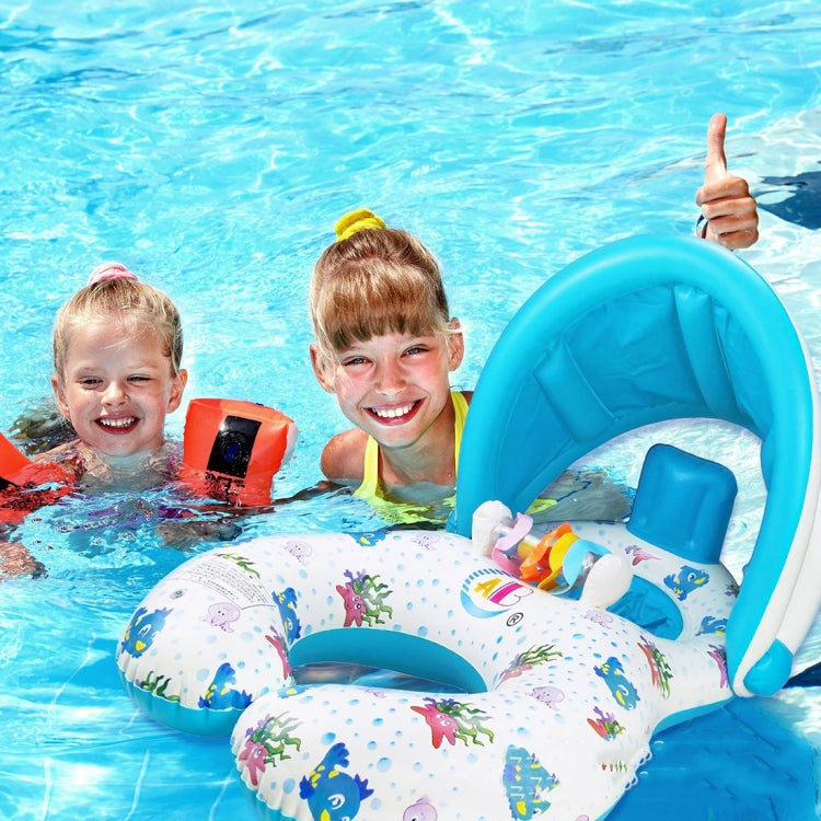 Kids in pool with white sea-life swimming ring and blue headrest