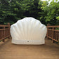 White scallop-shaped inflatable floating mat with scalloped shell shape