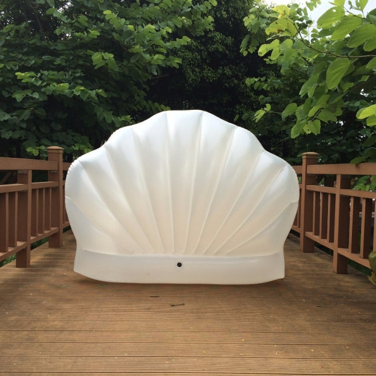 White scallop-shaped inflatable floating mat with scalloped shell shape