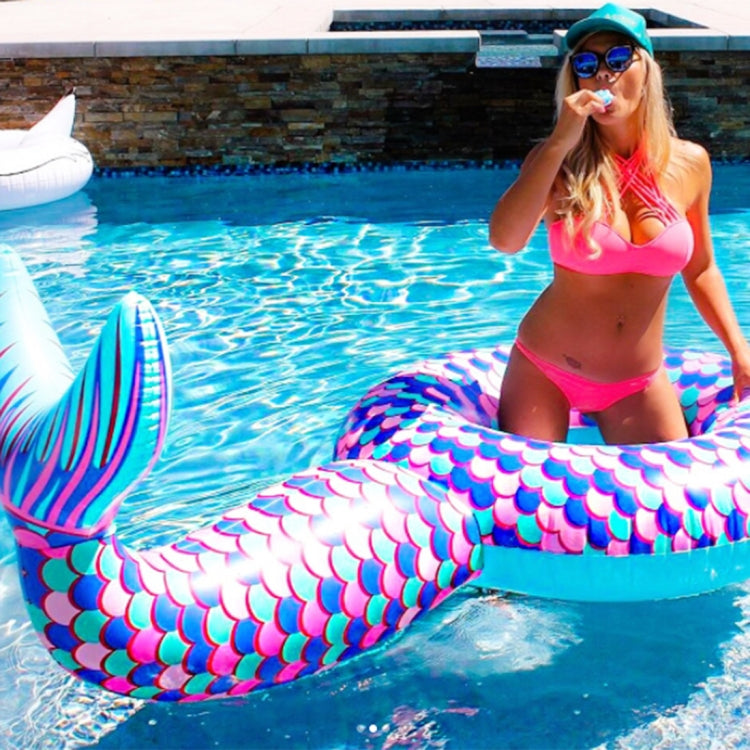 Inflatable mermaid tail pool lounge with purple-pink scale pattern and teal inner ring