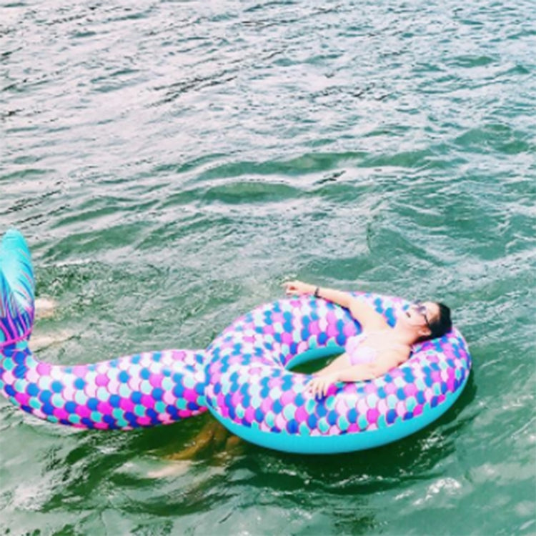 Inflatable mermaid tail pool lounge ring with purple-pink scales and teal rim