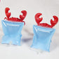 Two red crab-shaped arm float sleeves with blue inflatable cuffs