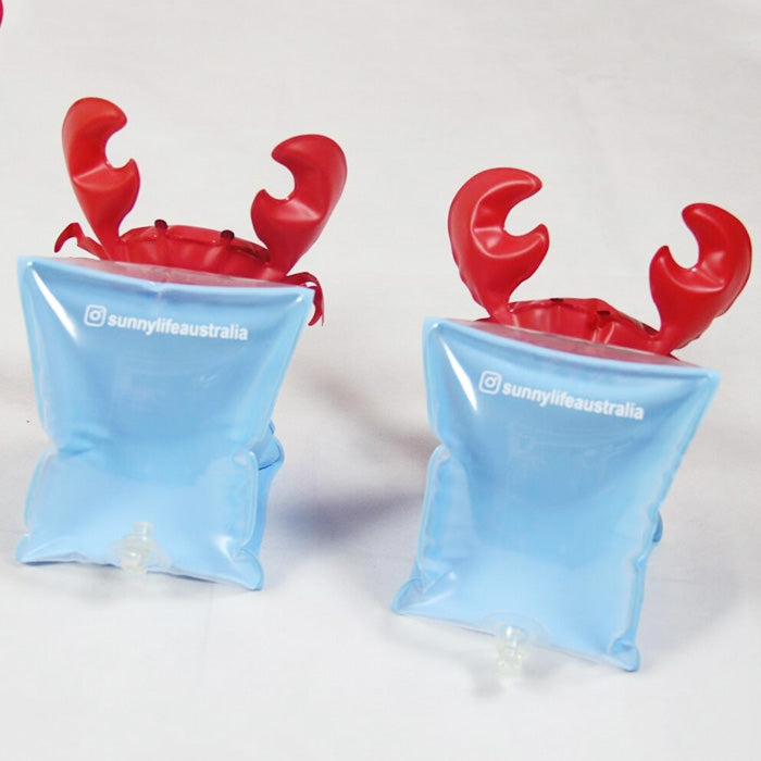 Two red crab-shaped arm float sleeves with blue inflatable cuffs