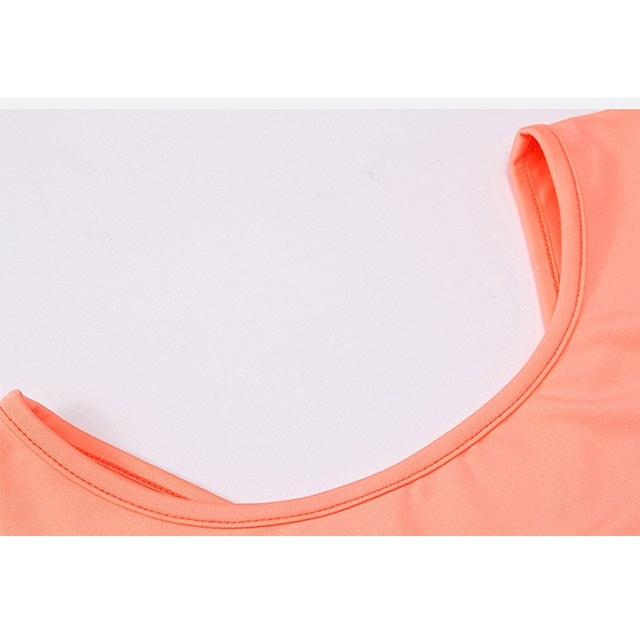 Coral yoga top neckline close-up with contrast edge stitching