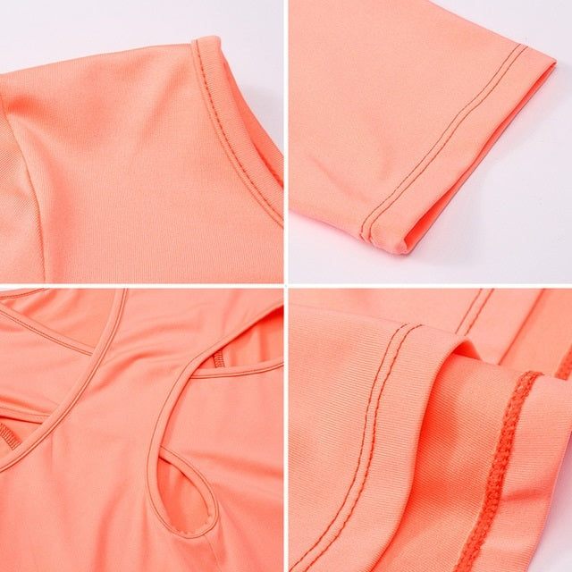 Coral yoga top detail: stitched seams, cutout back panel, sleeve hems