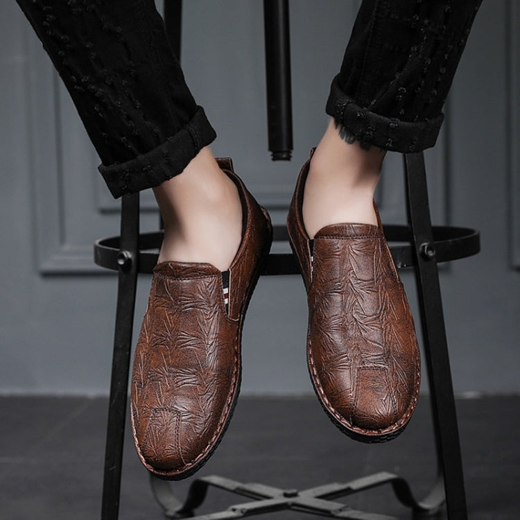 Dark brown leather slip-on shoes with round toe and side elastic panels