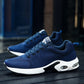 Pair of men's blue mesh lace-up running shoes with white sole and air-cushion detail