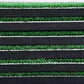 Close-up of layered mat construction: green turf on black foam padding