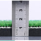 Golf mat thickness measurement shown with a metal ruler across the edge