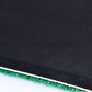 Mat edge view showing black border and green artificial grass pile