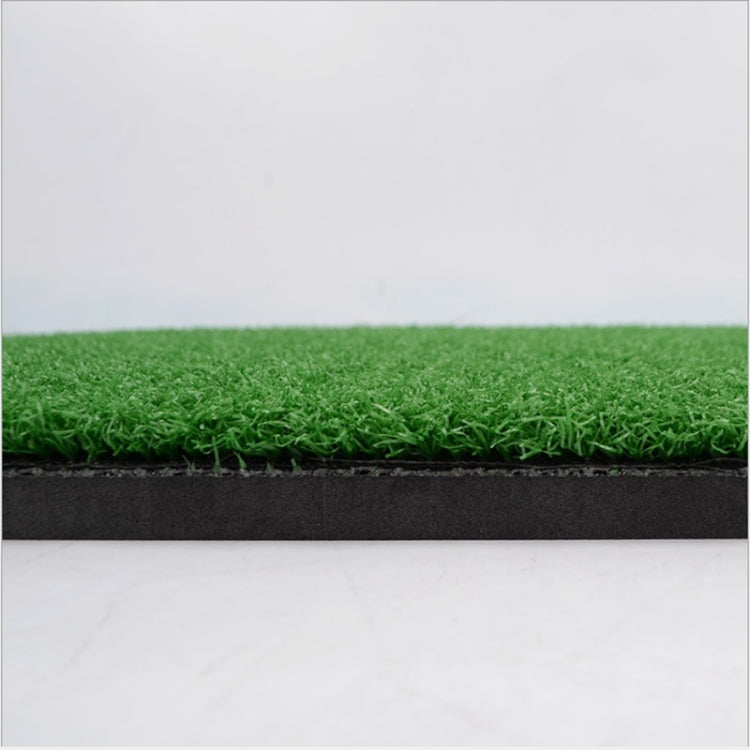 Green artificial grass golf practice mat with black edge trim and layered backing