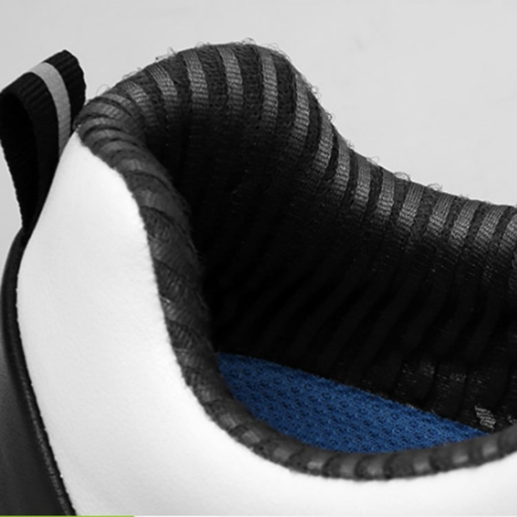 Interior lining of waterproof golf sneaker, black collar with blue cushioning insole