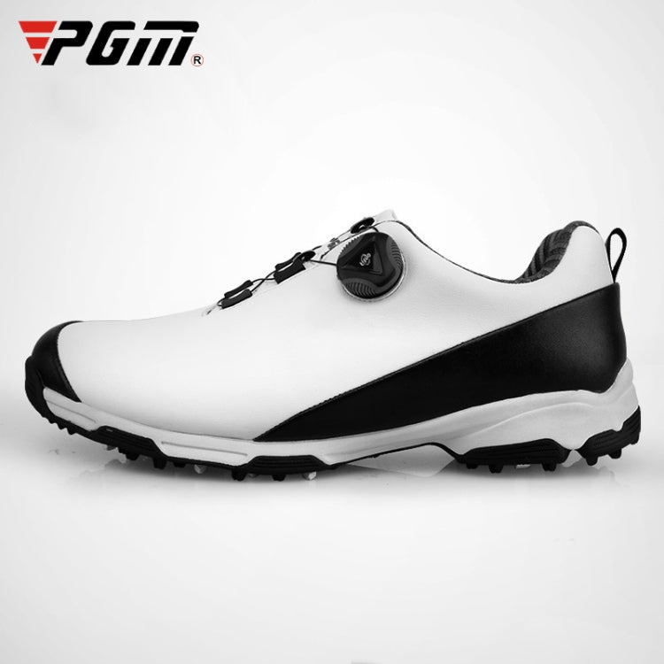 Men's white and black golf shoes with rotary buckle strap and rugged traction sole