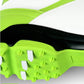 Close-up of neon green and white outsole with raised cleats and tread texture