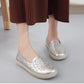 Women's white embroidered slip-on shoes with floral stitching, flat cushioned sole