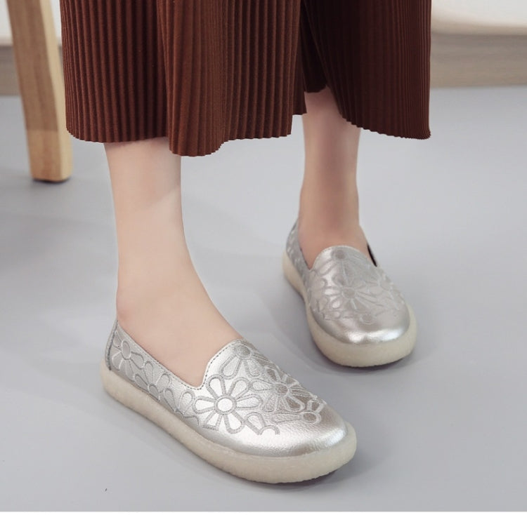 Women's white embroidered slip-on shoes with floral embossed upper, rounded toe