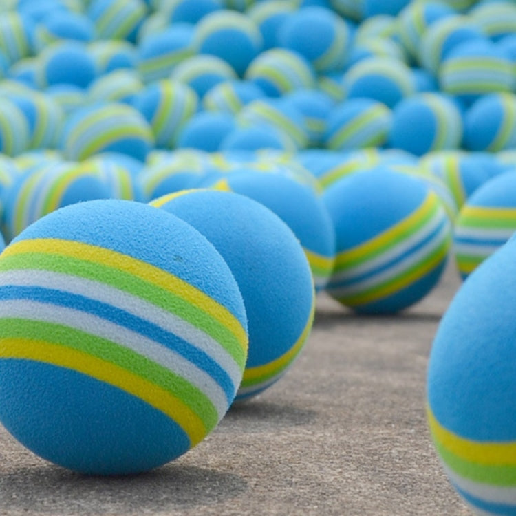 Close-up of blue striped sponge golf practice balls with green and yellow bands