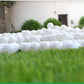 White hollow golf exercise balls, dense group of perforated balls