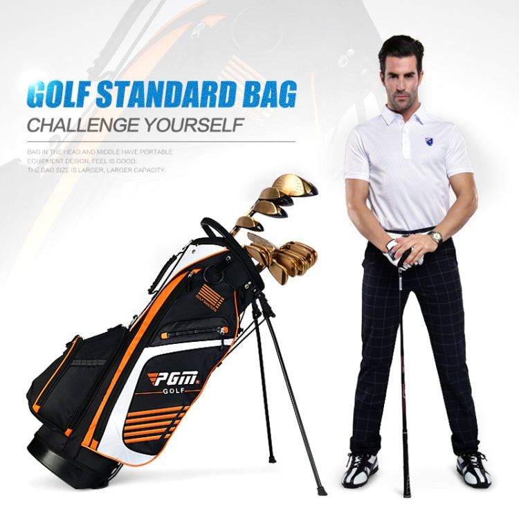 Black and white golf stand bag with orange accents and dual legs.