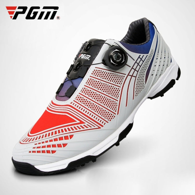 Lace-up golf sneakers with white upper, red stripe graphics, black strap, blue collar.