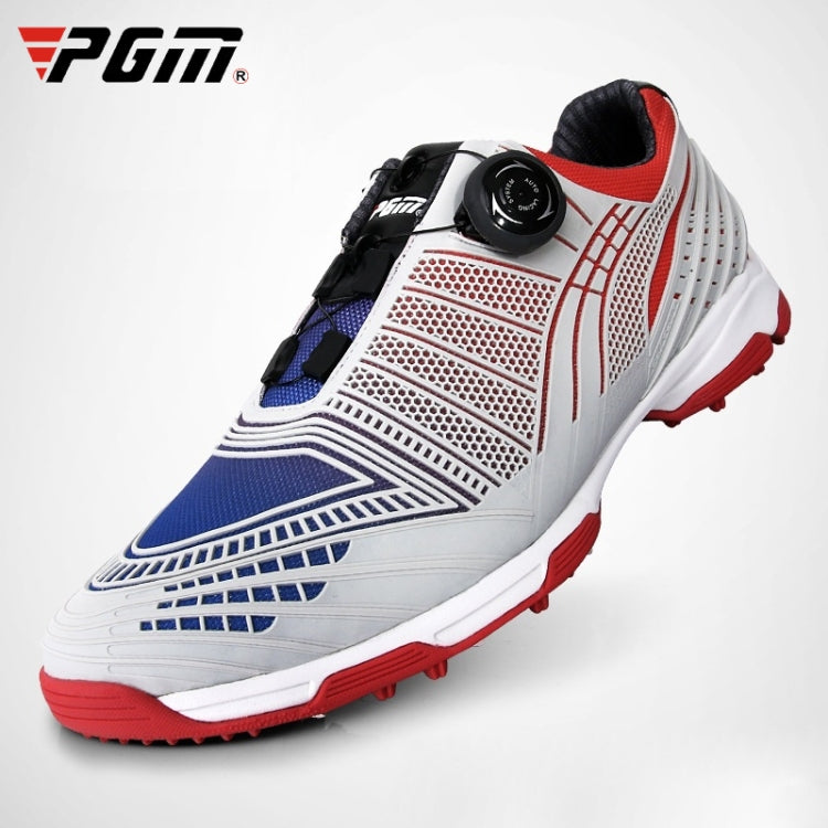 Lace-up golf sneakers with white upper, blue accents, black buckle, red traction outsole.