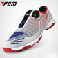 Lace-up golf sneakers with white upper, blue perforations, black strap, red outsole studs.