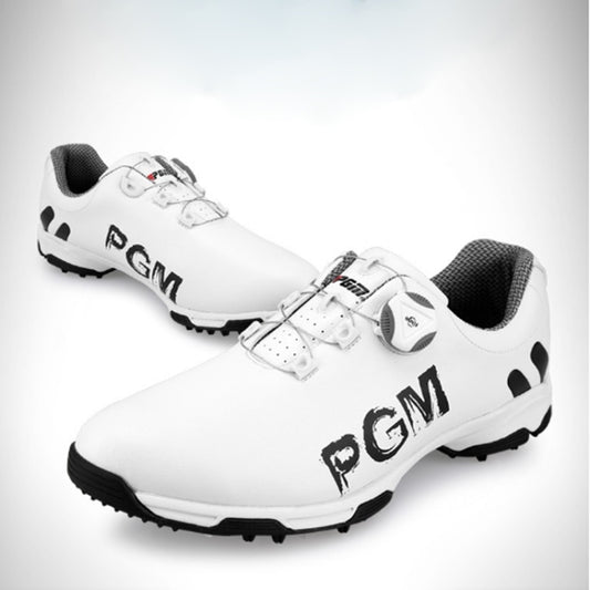Men's PGM golf sneakers pair, white leather-look upper with black logo and studs