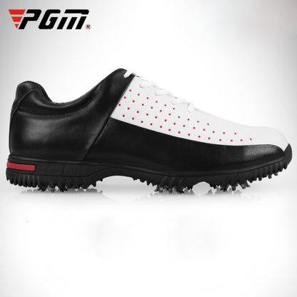 Men's golf sneakers, black and white with red dot accents and cleated rubber sole