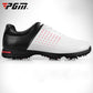 Men's black and white lace-up golf sneakers with red dot panel and studded traction sole.