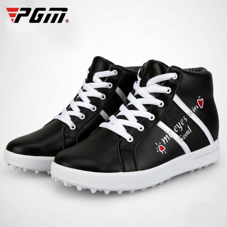 Black high-top golf sneakers with white laces and logo graphics; white studded outsole