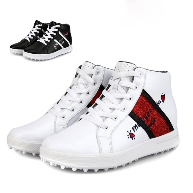 White high-top golf sneakers with red panel and black stripe; white studded outsole