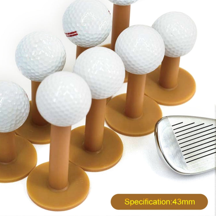 Set of white golf balls on amber rubber tendon tees with round bases