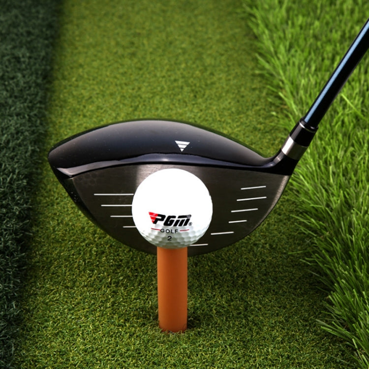 Amber rubber golf tendon tee holding a white golf ball on a round base
