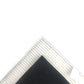 Vacuum cleaner filter corner showing white pleated grid beneath dark foam pad