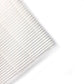 Vacuum cleaner filter mesh close-up with white pleated lines and corner cutout