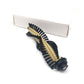 Robot vacuum main brush with gold roller and black bristles in cardboard sleeve