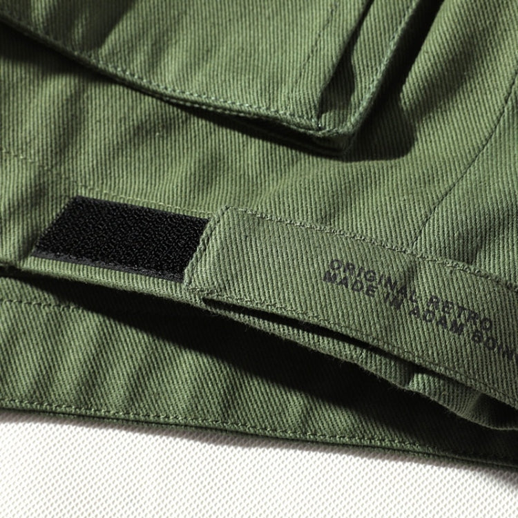 Olive green jacket chest pocket with flap and stitched trim