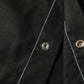 Men's black shirt jacket with metal snap buttons on the front placket